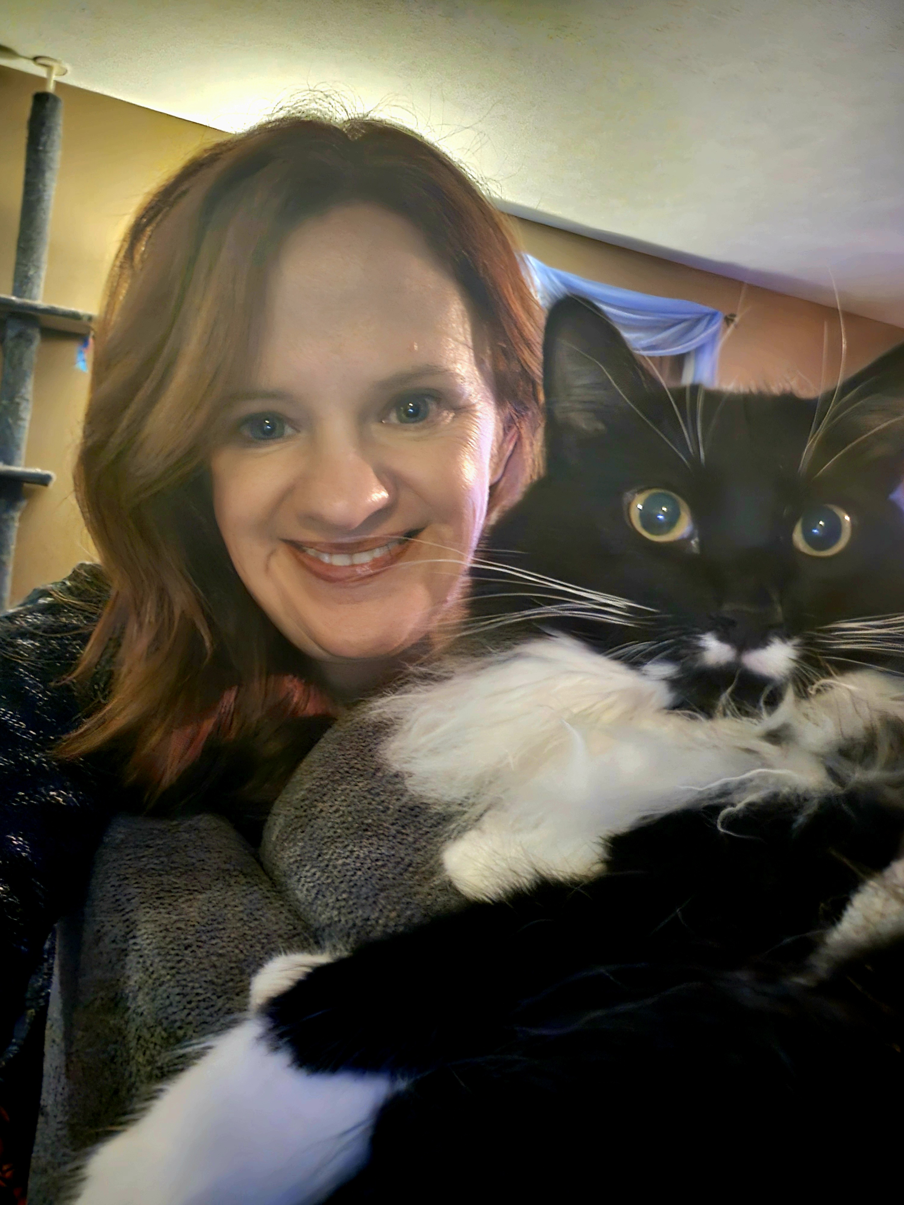 KJ with her tuxedo cat